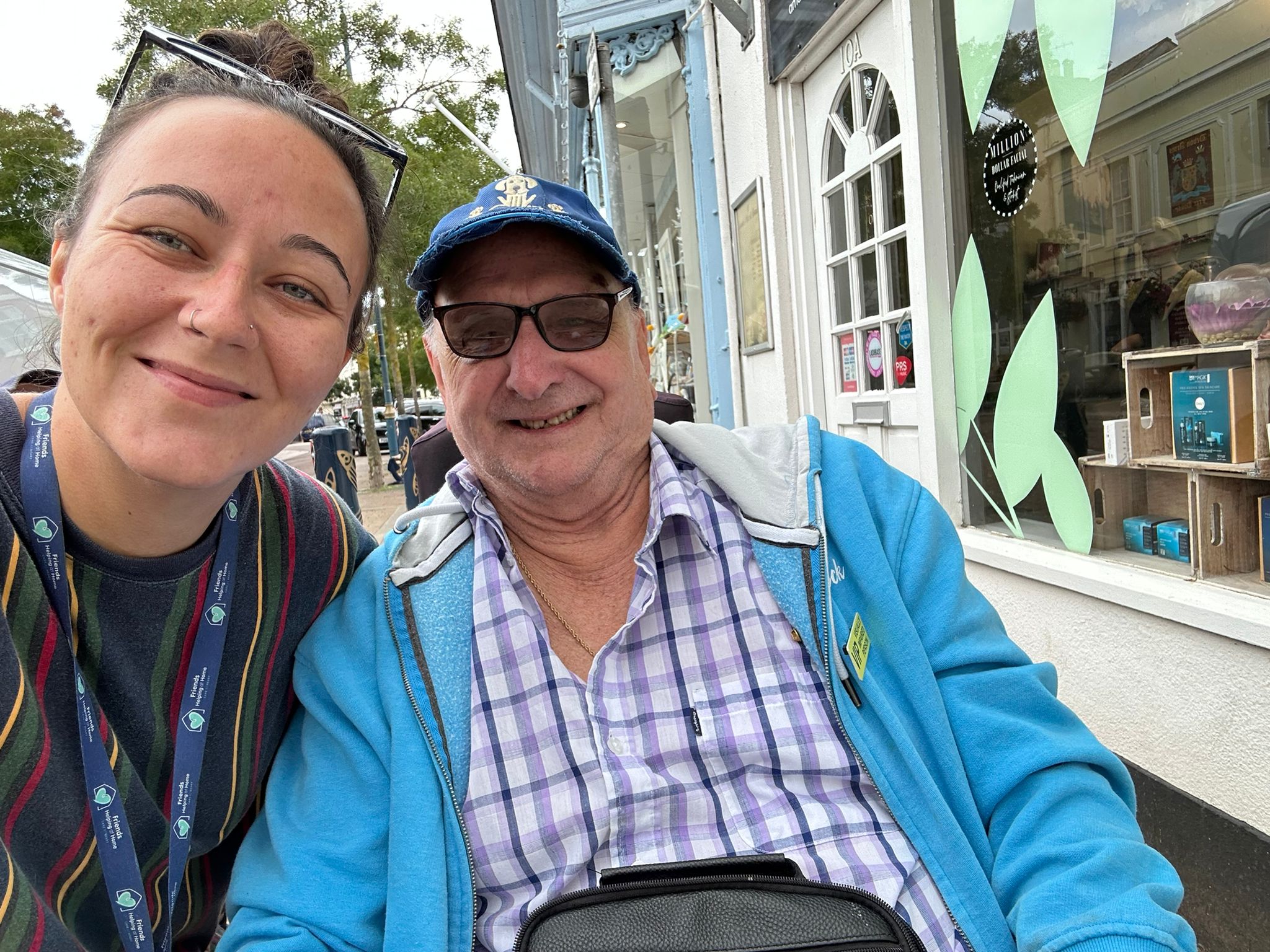 A smiling Friends Helping at Home support partner with an older gentleman in his community